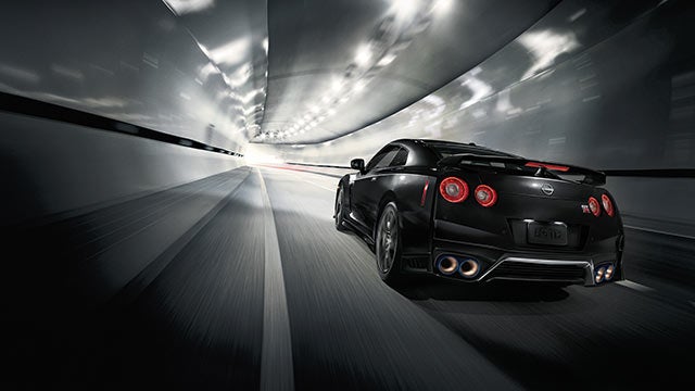 2023 Nissan GT-R seen from behind driving through a tunnel | Auffenberg Nissan in Shiloh IL